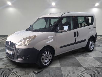 a picture of a white van parked on a checkered floor