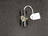 a ring that is sitting on top of a black object