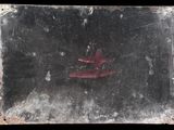 a picture of a red fire hydrant in a dirty window