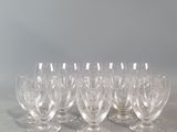 a set of six clear wine glasses sitting on top of a table