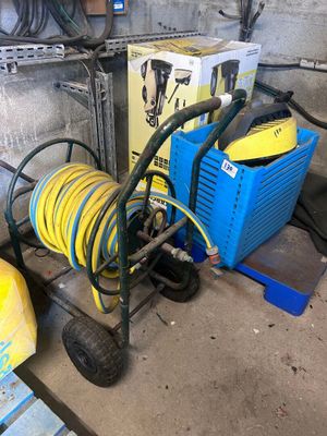 a cart with a hose and a cart with a hose attached to it