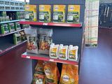 a display of dog food in the store for sale