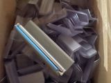 a cardboard box filled with a lot of different types of electronic gadgets