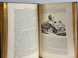 an open book with a picture of a man driving a car