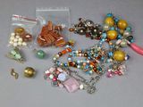 a lot of beads and charms on a table