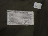 the back of a jacket with a label on it that says jacket field mh - 34