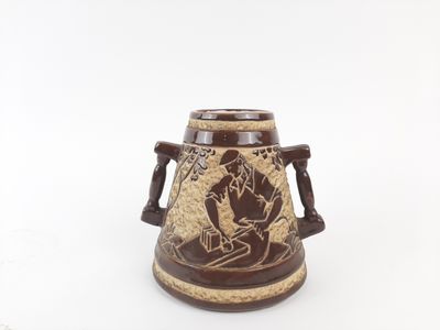 an image of a brown and white vase with a man on it