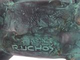 statue of a bull with a tag on it ' s side
