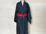an image of a black robe with a red belt on a mannequin dummy