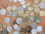 a lot of coins that are on the table