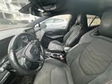 a picture of a car that is sitting in the street