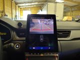 a cell phone that is sitting in the dashboard of a car