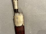 an old baseball bat that has been left on the table