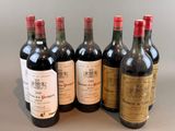 six bottles of wine are lined up in a row on a table