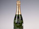 a bottle of champagne sitting on top of a white table