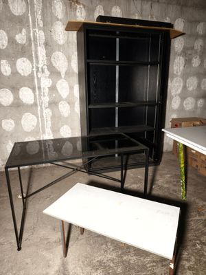 two tables and a bench in a room