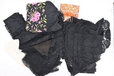 several pieces of clothing are laid out on a white surface