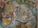 peinture sur le mur d'un bar représentant un homme jouant d'un instrument de musique