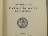 an open book with a picture of a coin on it