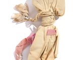 a cloth bag tied to a string with a bow