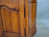 an image of a wooden cabinet with a marble top