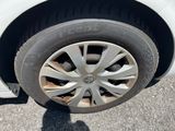 a white car that has a flat tire on it