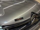 a close up of a car that is on display in a showroom