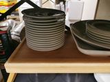 a stack of plates on a shelf in a kitchen