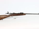 an old rifle with a wooden barrel on a white background