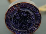 a close up of a stamp on a baseball bat