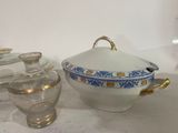 a white bowl with a blue and yellow design on it