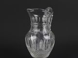 an image of a clear glass pitcher on a black background