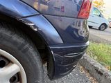 a close up of a car with a flat tire
