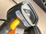 an image of a car ' s dashboard with a corded plugged in to a charger