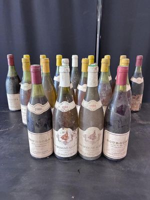 several bottles of wine are lined up on a table