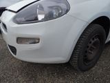 a white car that has a dent in the front of it