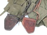 many different types of military items on a white surface