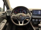 the interior of a car with a steering wheel and dashboard controls