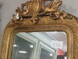 a mirror that is sitting on the wall in the room