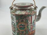 an image of a tea pot with a handle on a white background