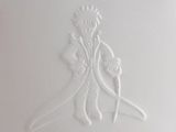 a white plate with a design of a man and a woman on it