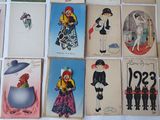 a lot of old postcards on the table