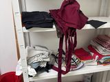 a book shelf with a backpack on top of it