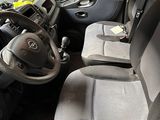 the interior of a small van with a steering wheel and a dashboard