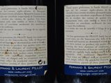 two bottles of wine that are sitting on a table
