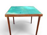 une image représentant une petite table au plateau vert sur fond blanc