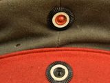 an image of a military hat with buttons on it