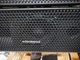 a close up of a speaker on a tripod