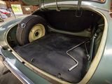 a trunk of a car with a tire in it