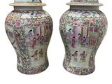 pair of chinese vases with asian scenes on them on a white background